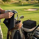 Microfibre golf towel clipped to a bag wiping a club